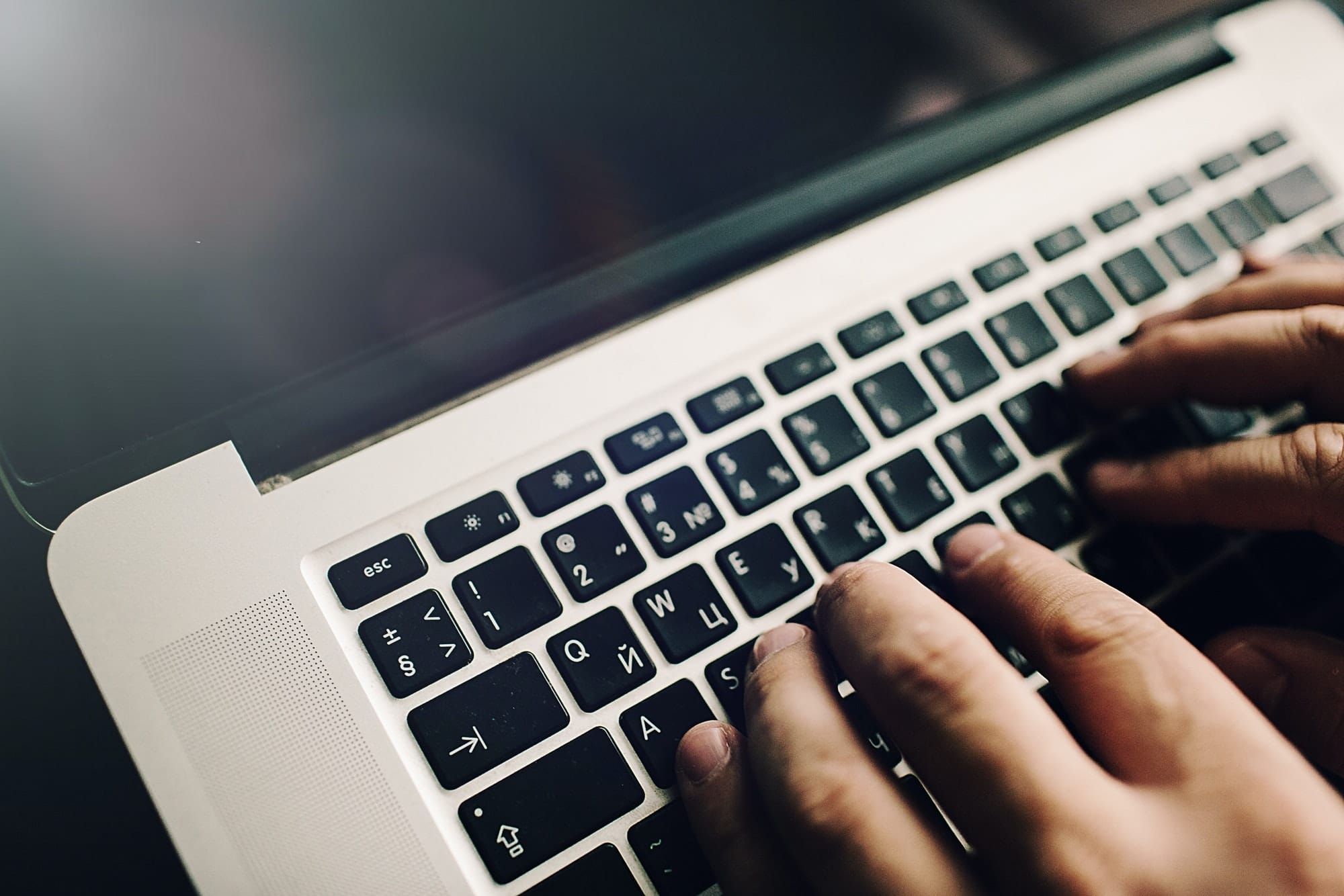 Mans hands on laptop. Business man work on computer